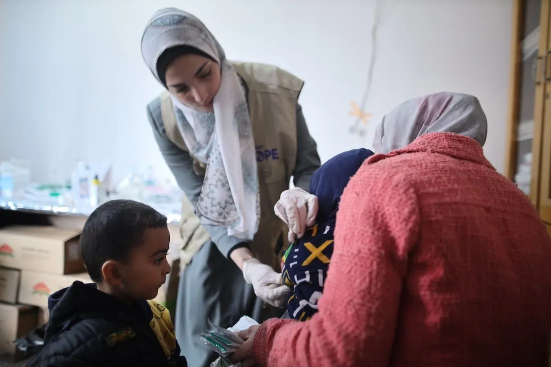 woman treating child in clinic