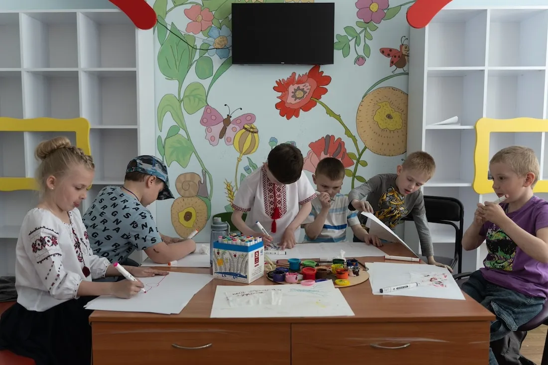 children doing art therapy in a safe space