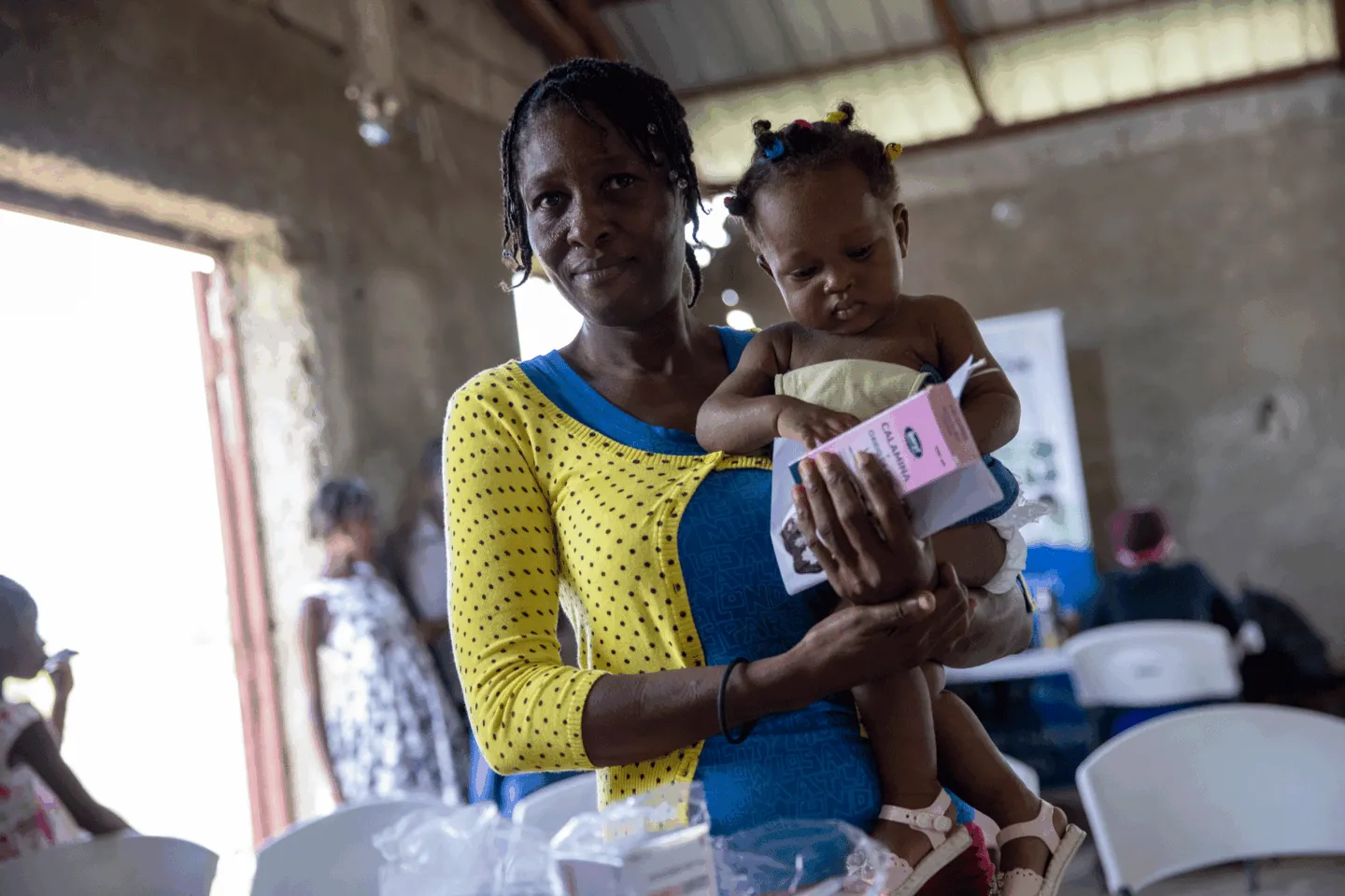 mother holds young baby girl