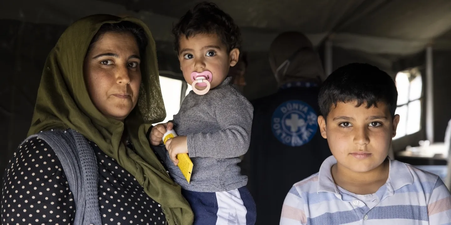 A mother and her two sons getting medical attention after the Turkiye earthquake