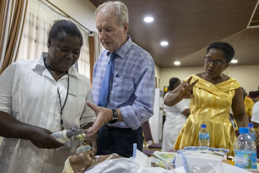 woman holding medical equipment