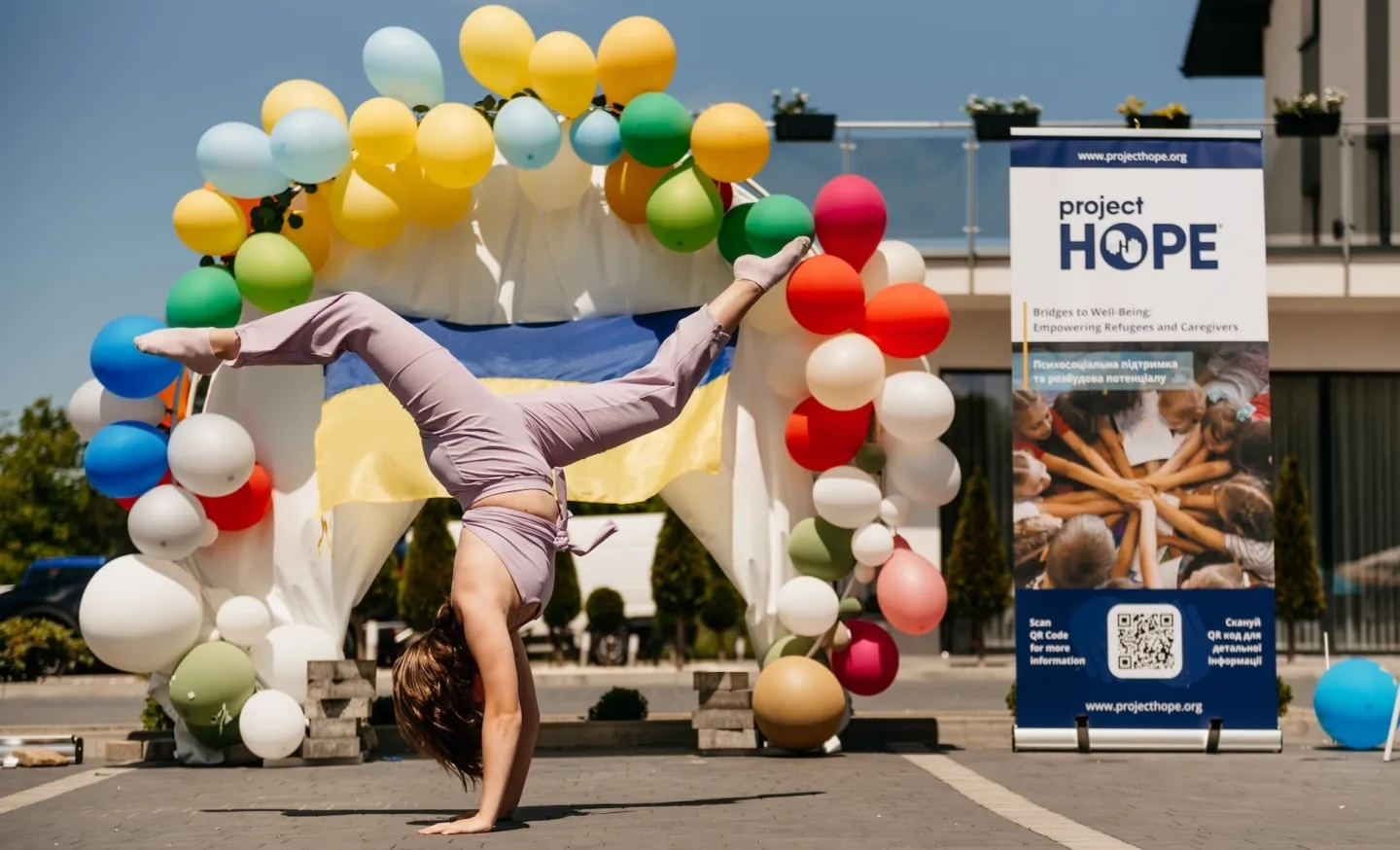 woman doing a handstand outside
