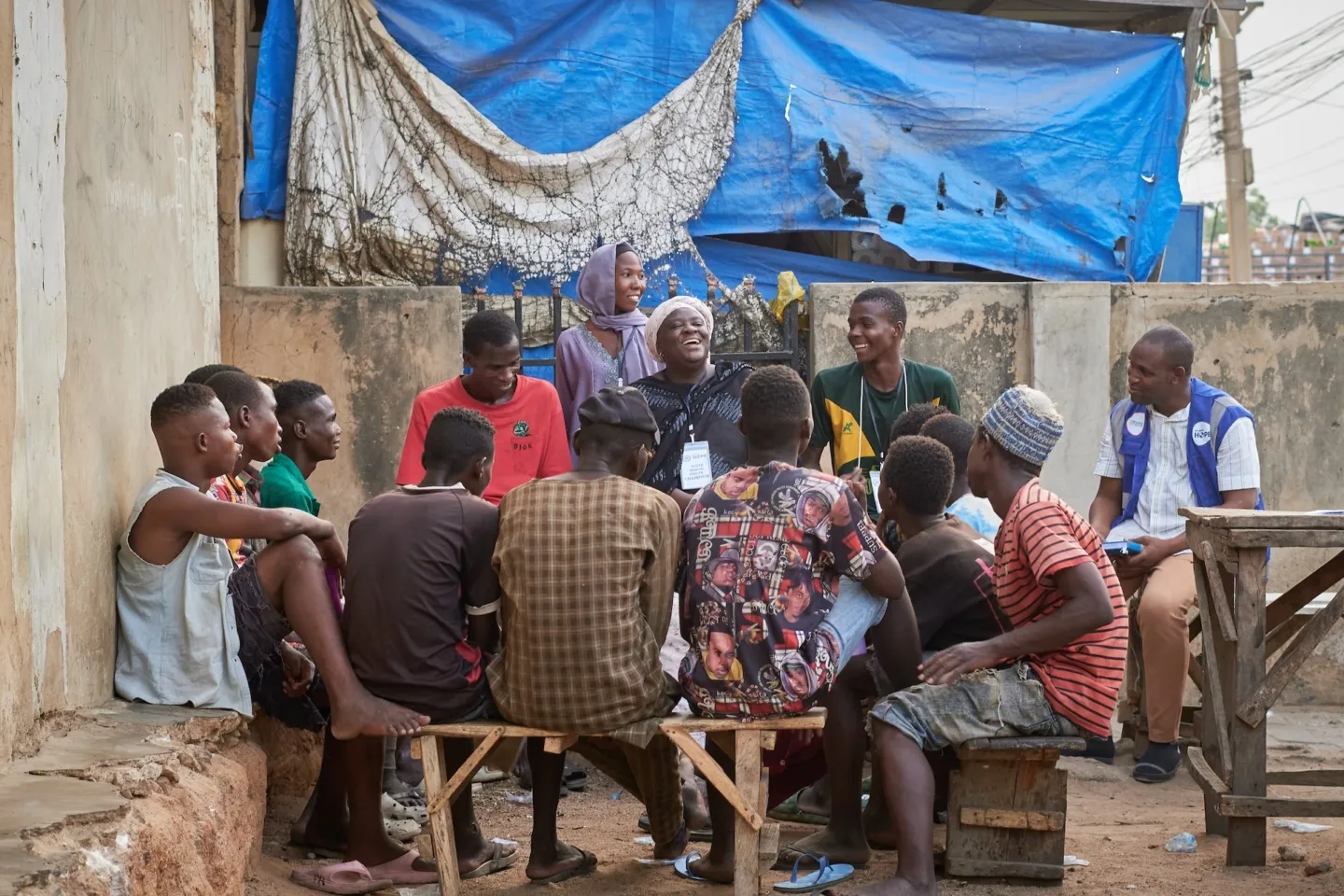 group of young men speaking together