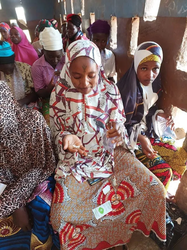 woman getting checked by a doctor in Nigeria.
