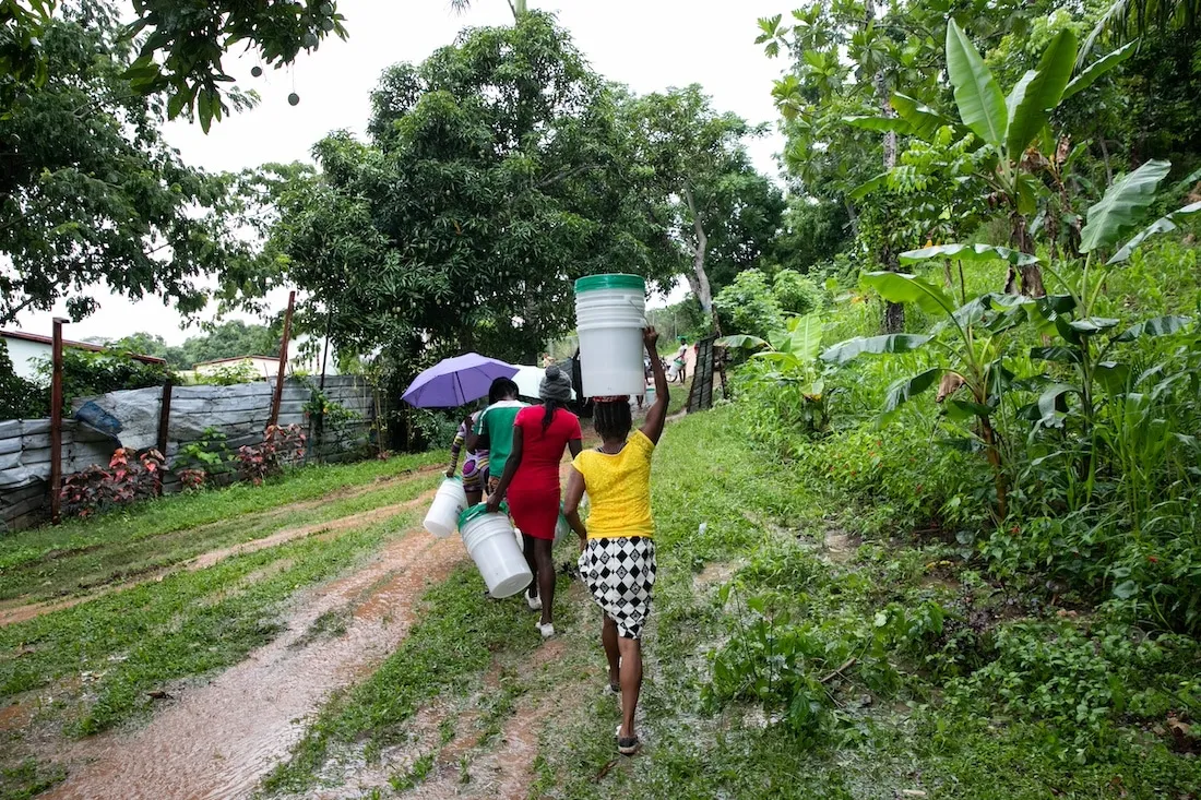 women walking down road