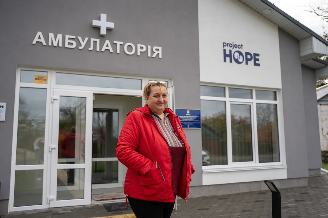 woman standing in front of clinic