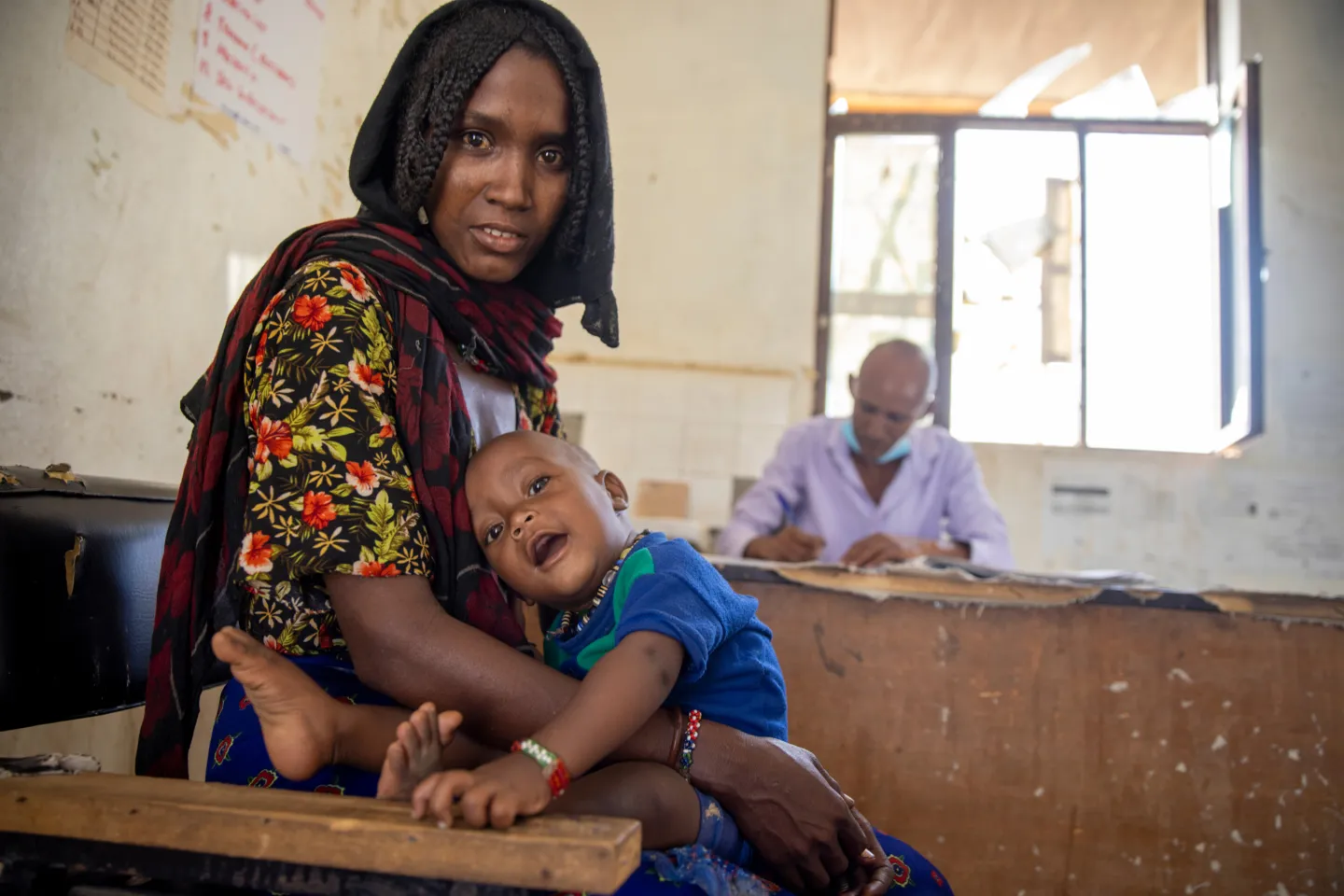 mother with child smiling to the camera in Ethiopia