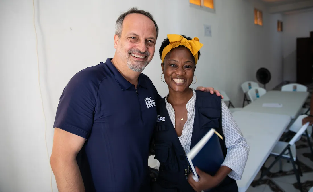 Rabih Torbay with Regine Necessaire smiling at the camera