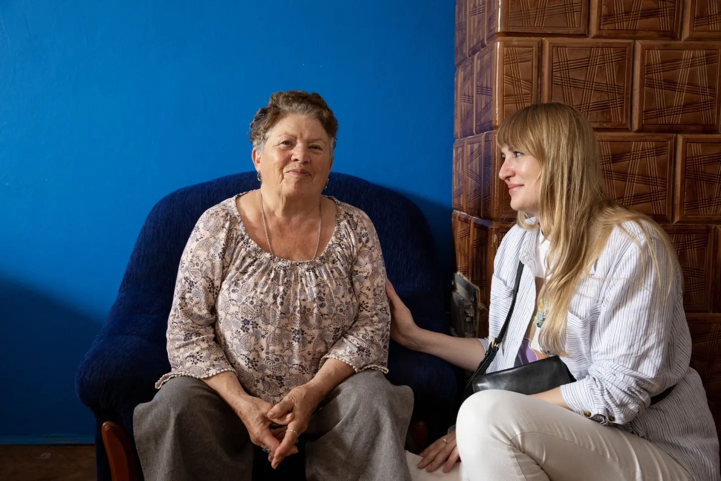 Two women sitting together in Poland. One is a psychologist and the other is her patient
