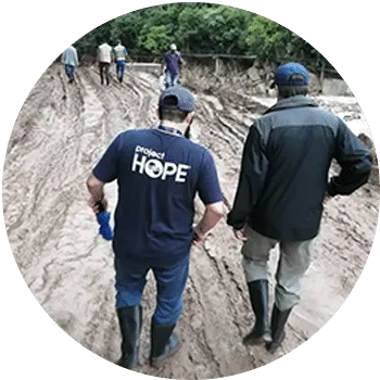 two men walking down a road