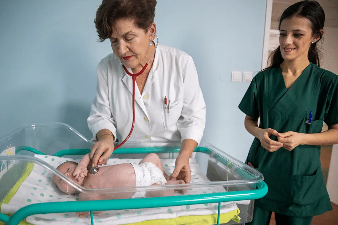 Doctor does a newborn check up.