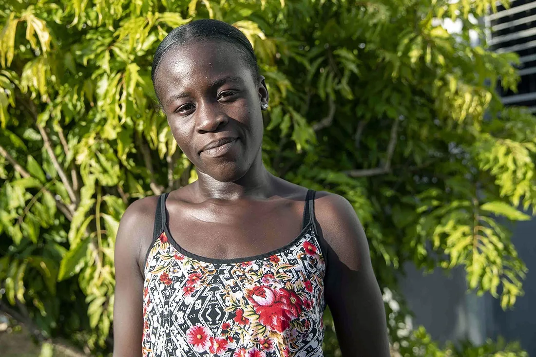 Black woman with floral tank top