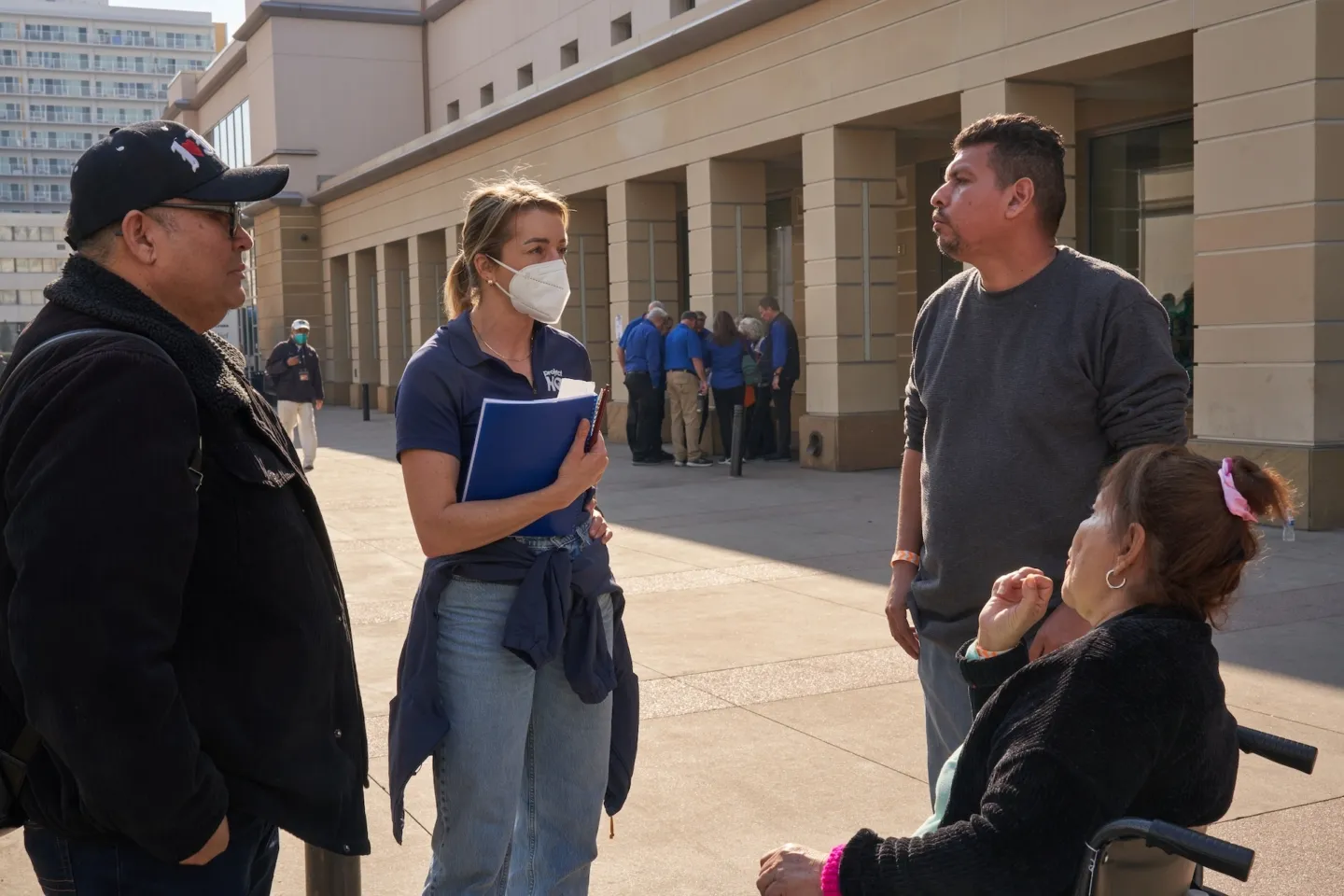 woman speaking with family outdoors