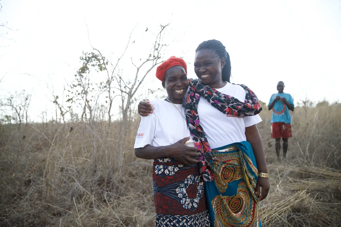 two women smiling together