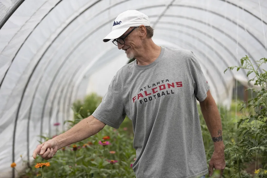 Lamar working at the farm at MercyMed