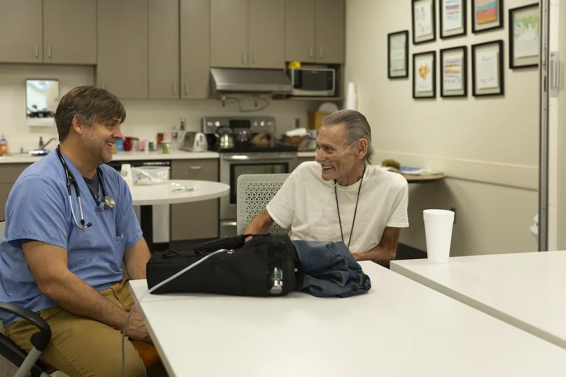 Ernest with the doctor at MercyMed in Columbus, Ga.