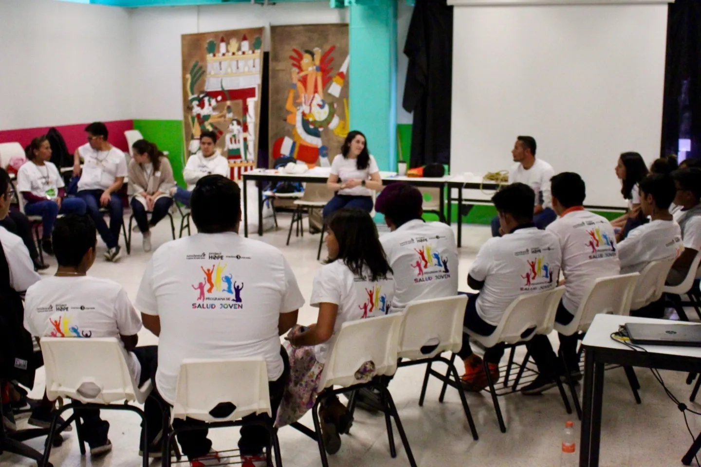 group of people sitting in a circle