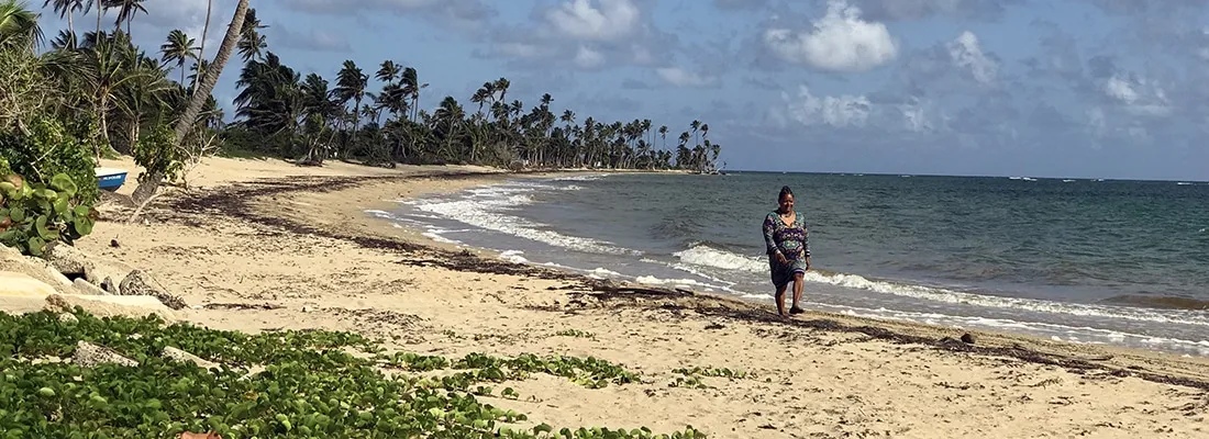 woman walking along beach