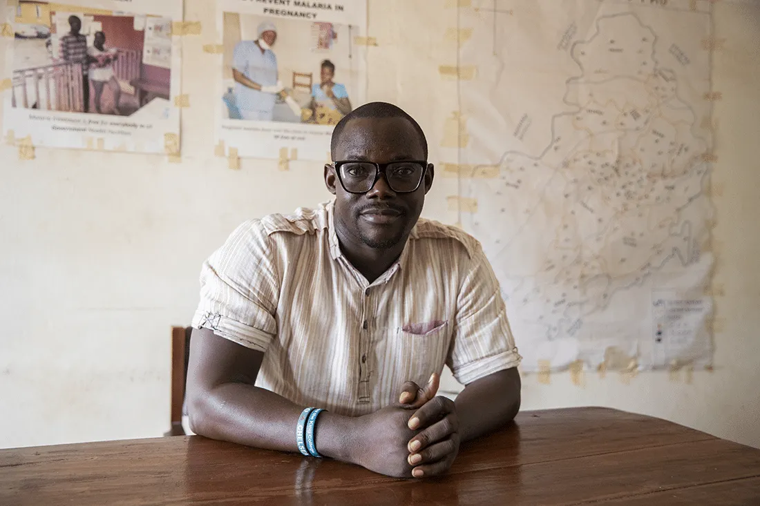 man with glasses sitting at table