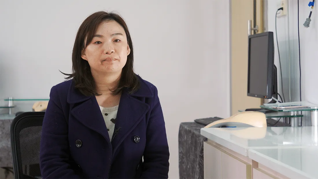 Nursing student sits in her lab.